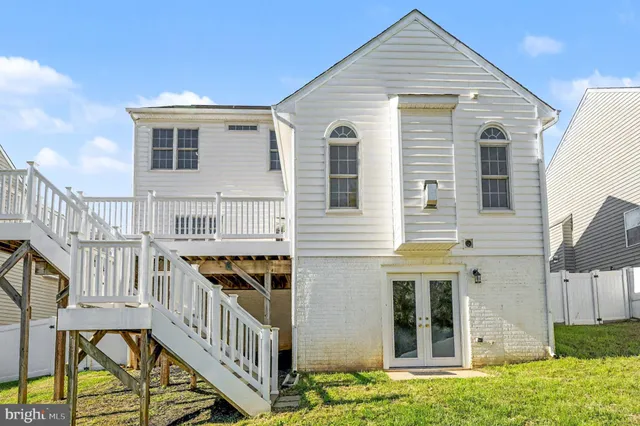 a view of a house with wooden stairs