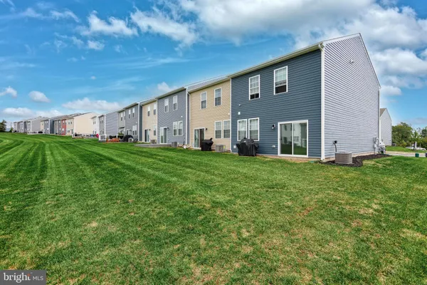 a big house with a big yard and more windows