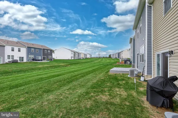 a view of a house with a back yard