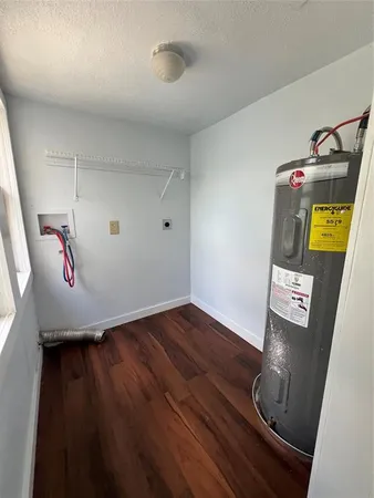 a view of room with wooden floor