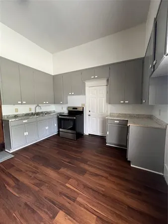 a view of kitchen with wooden floor