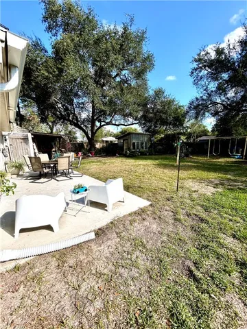 a view of a park with large trees