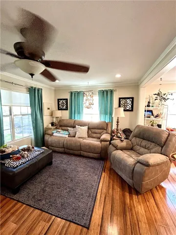 a living room with furniture and a rug