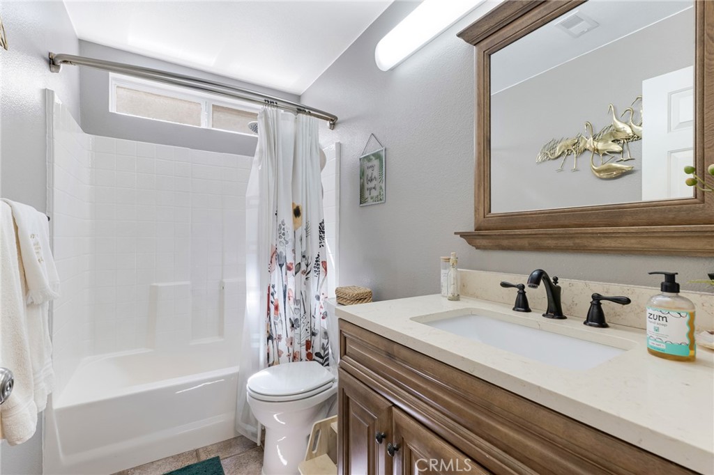 3843 San Gabriel Street Simi Valley, CA 93063 - Photo 29 of 52 a bathroom with a sink a toilet and shower