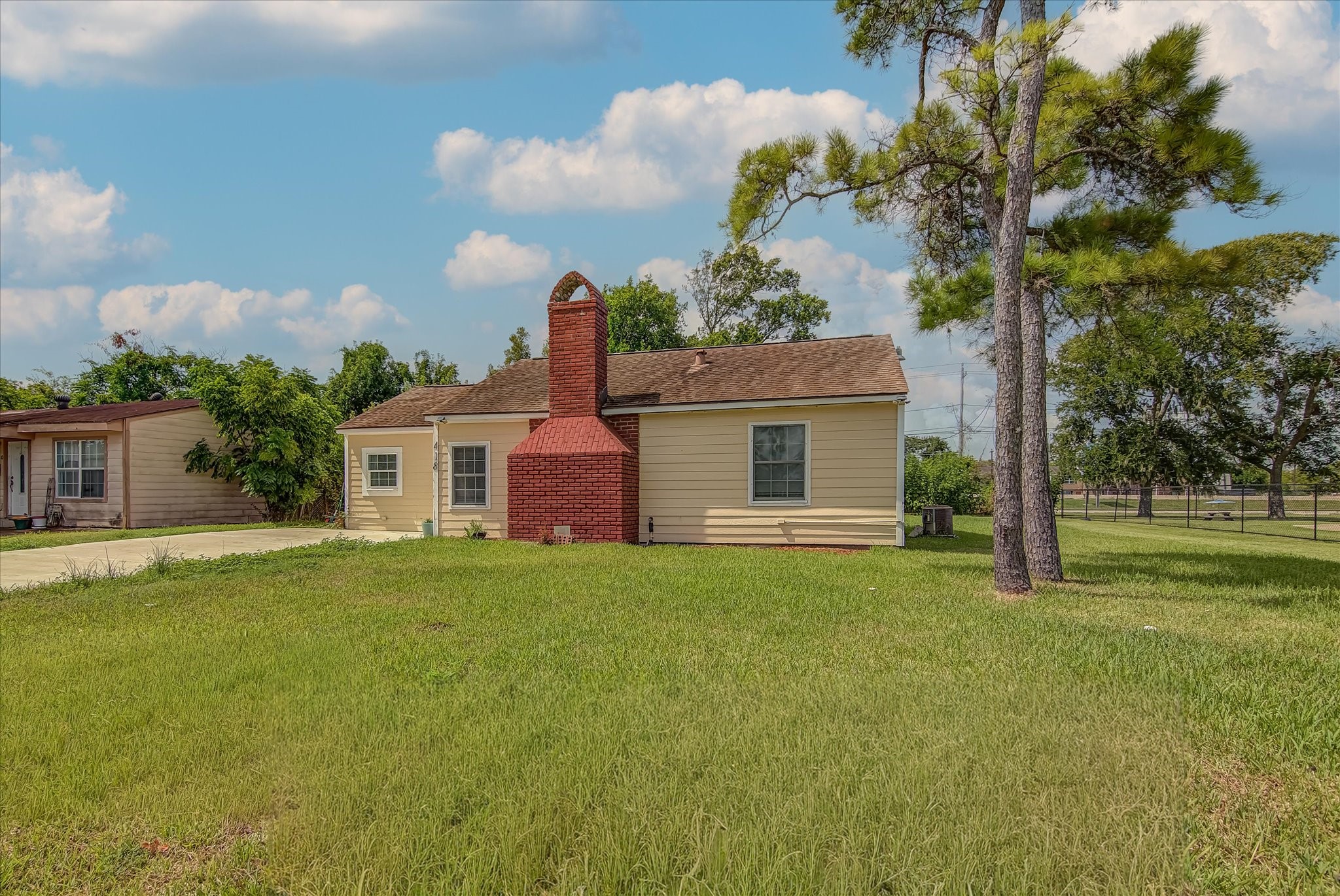 418 Azalea Street Lake Jackson, TX 77566 - Photo 1 of 34 a front view of a house with garden