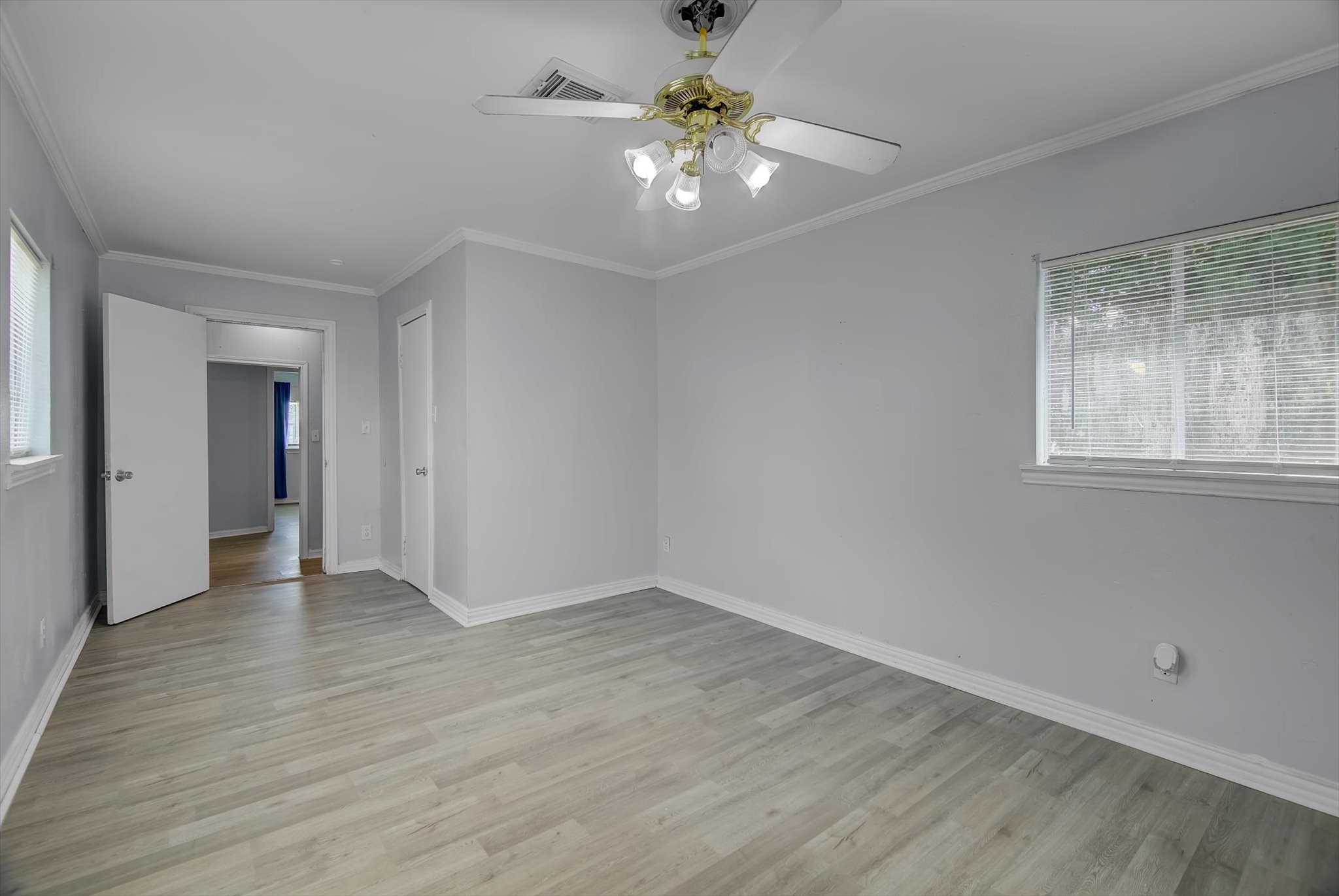 418 Azalea Street Lake Jackson, TX 77566 - Photo 16 of 34 wooden floor in an empty room with a window