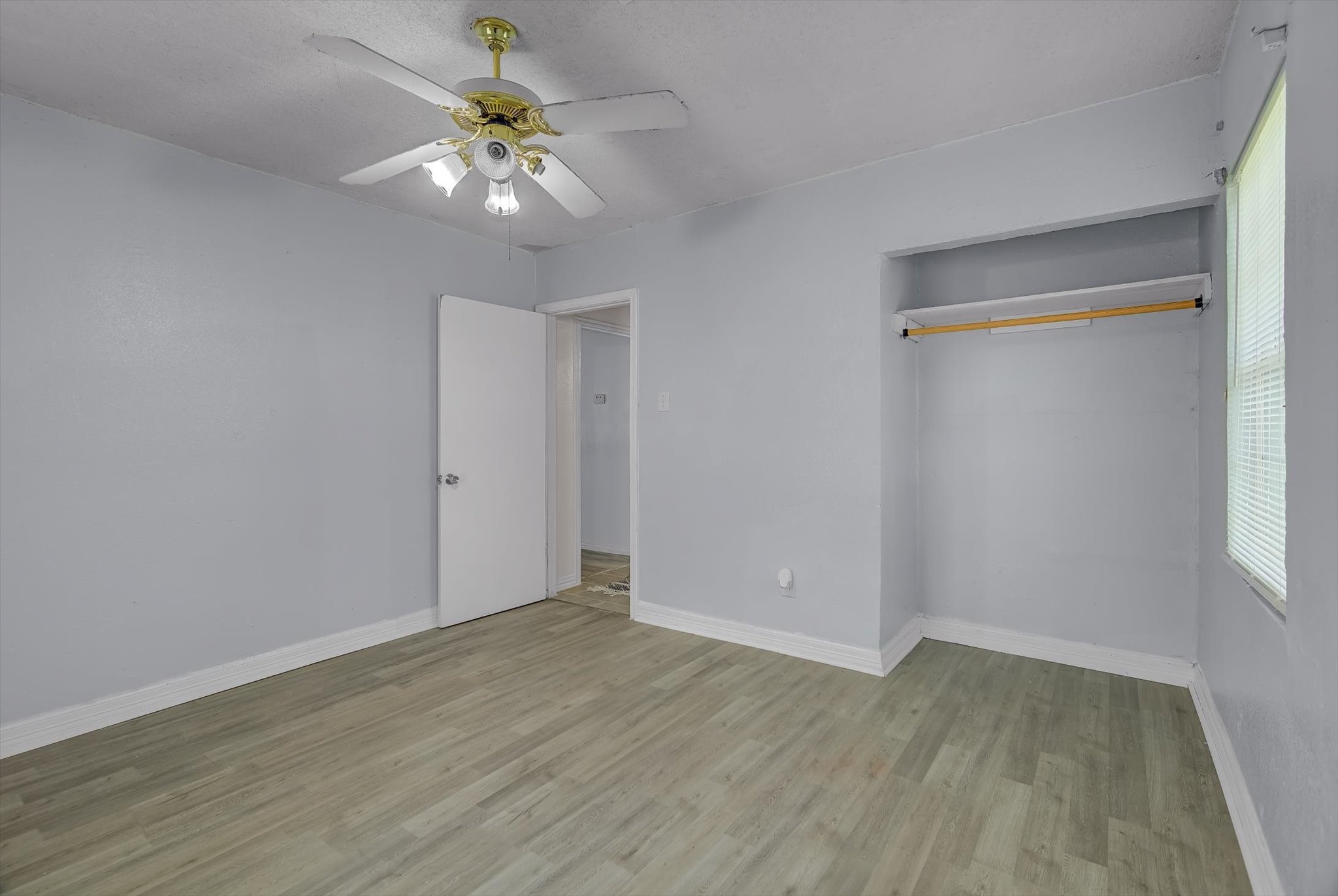 418 Azalea Street Lake Jackson, TX 77566 - Photo 23 of 34 a view of an empty room with wooden floor