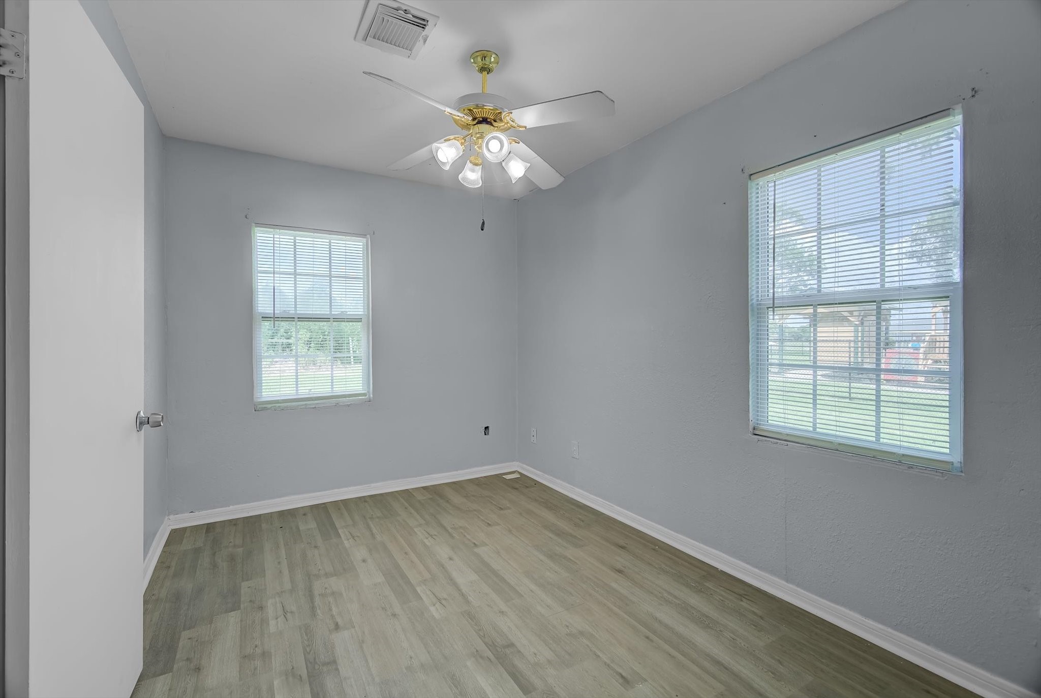 418 Azalea Street Lake Jackson, TX 77566 - Photo 24 of 34 an empty room with wooden floor and windows