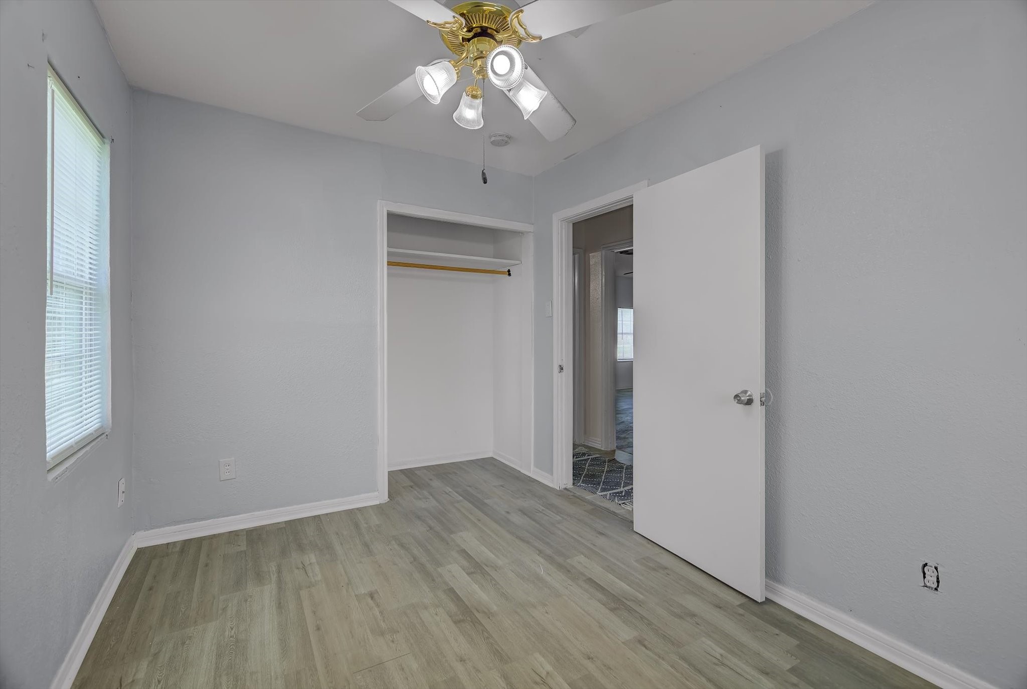418 Azalea Street Lake Jackson, TX 77566 - Photo 26 of 34 wooden floor in an empty room with a window