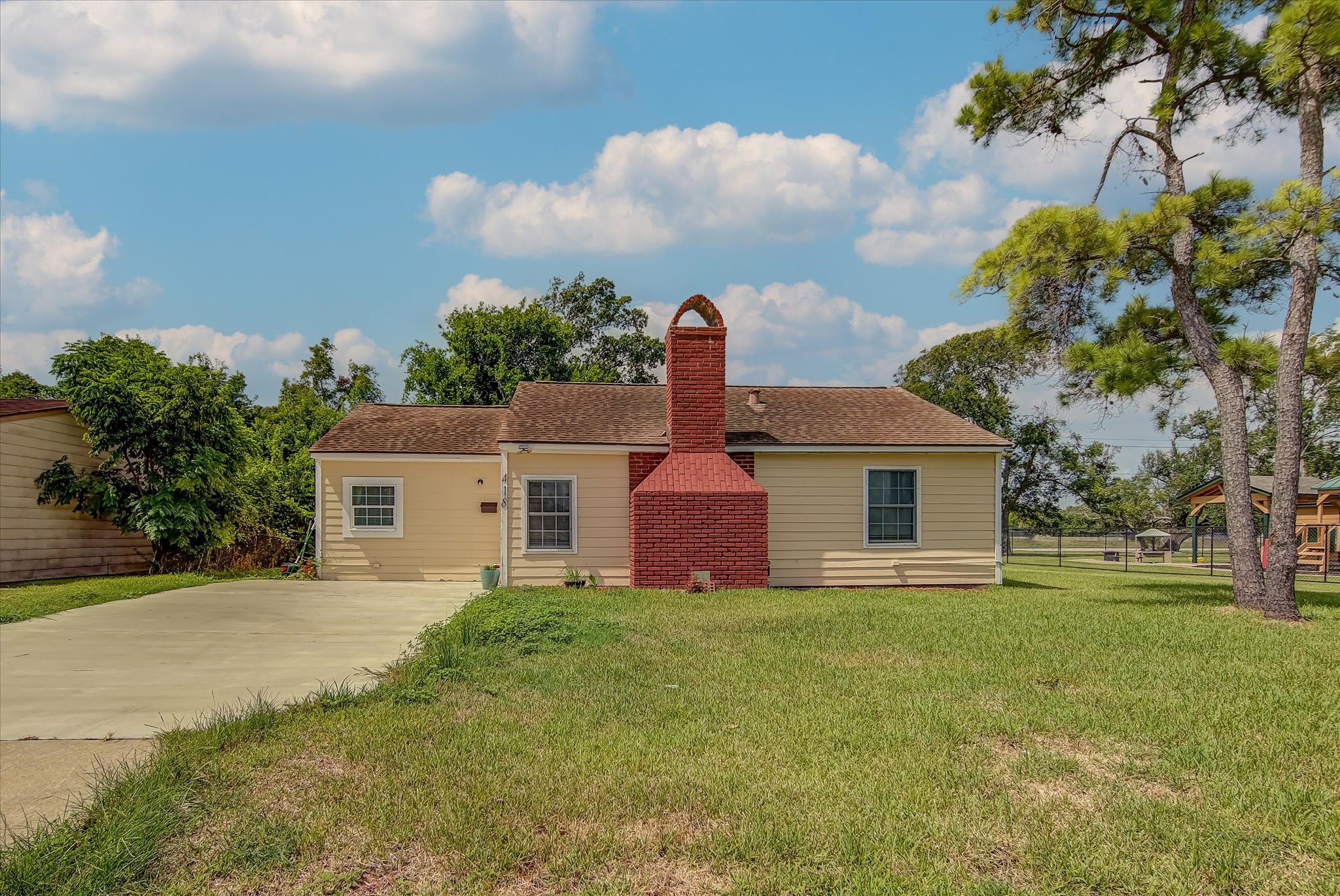 418 Azalea Street Lake Jackson, TX 77566 - Photo 3 of 34 front view of a house with a yard
