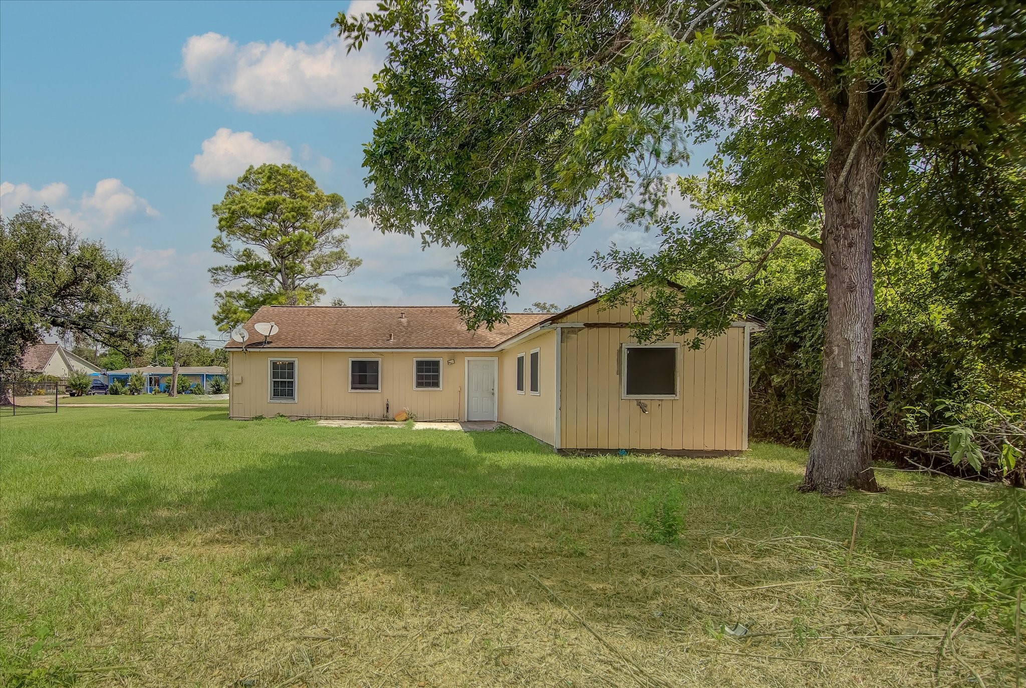 418 Azalea Street Lake Jackson, TX 77566 - Photo 32 of 34 a view of a house in front of a big yard with large trees