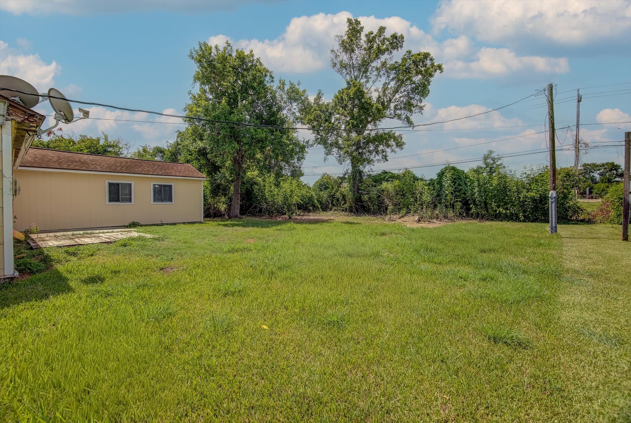418 Azalea Street Lake Jackson, TX 77566 - Photo 33 of 34 a house view with a garden space