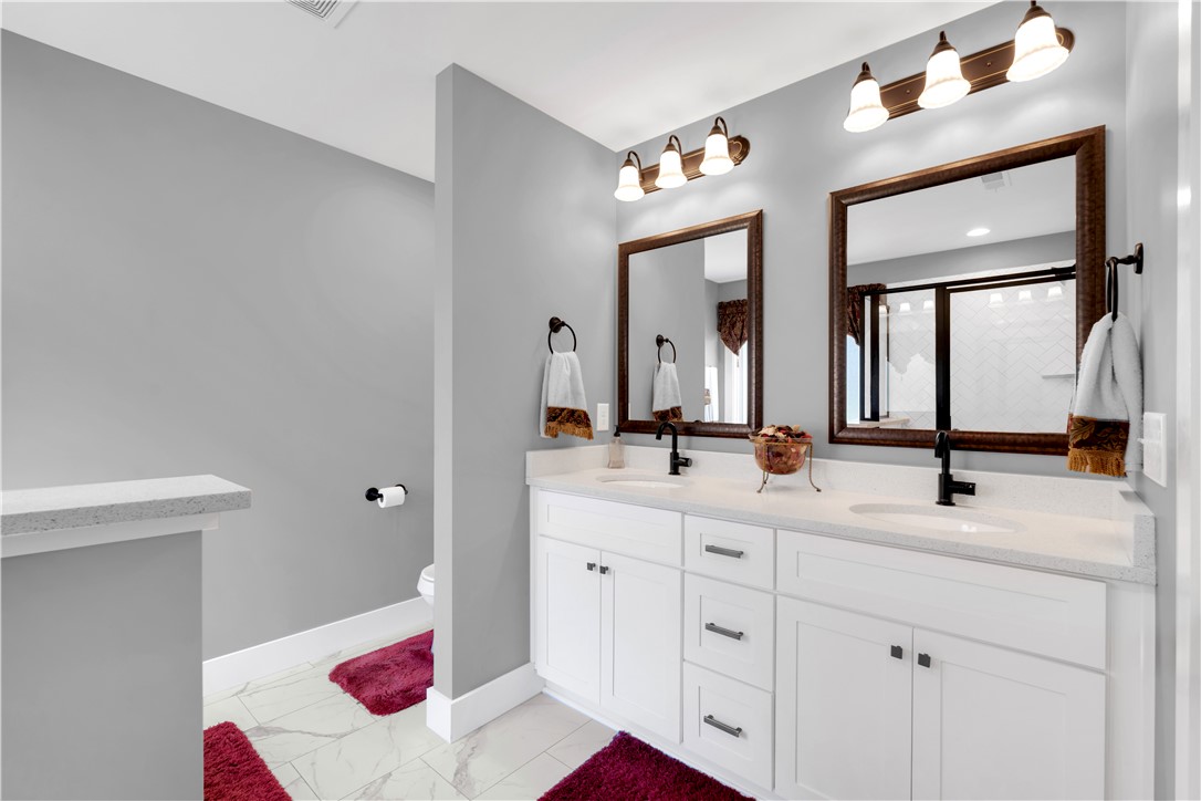 181 Amberwood Drive Anderson, SC 29621 - Photo 17 of 28 This spacious primary bathroom features dual vanities and modern finishes for ultimate comfort.