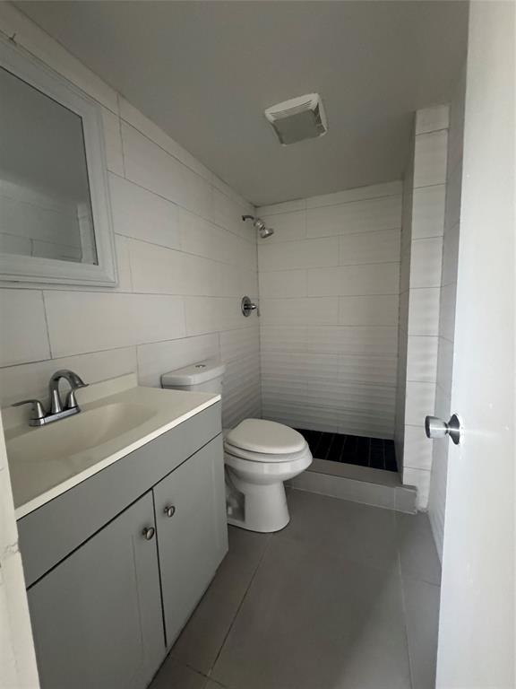9235 A Lagoon Place, Unit 310 Davie, FL 33324 - Photo 22 of 32 a bathroom with a sink toilet and shower