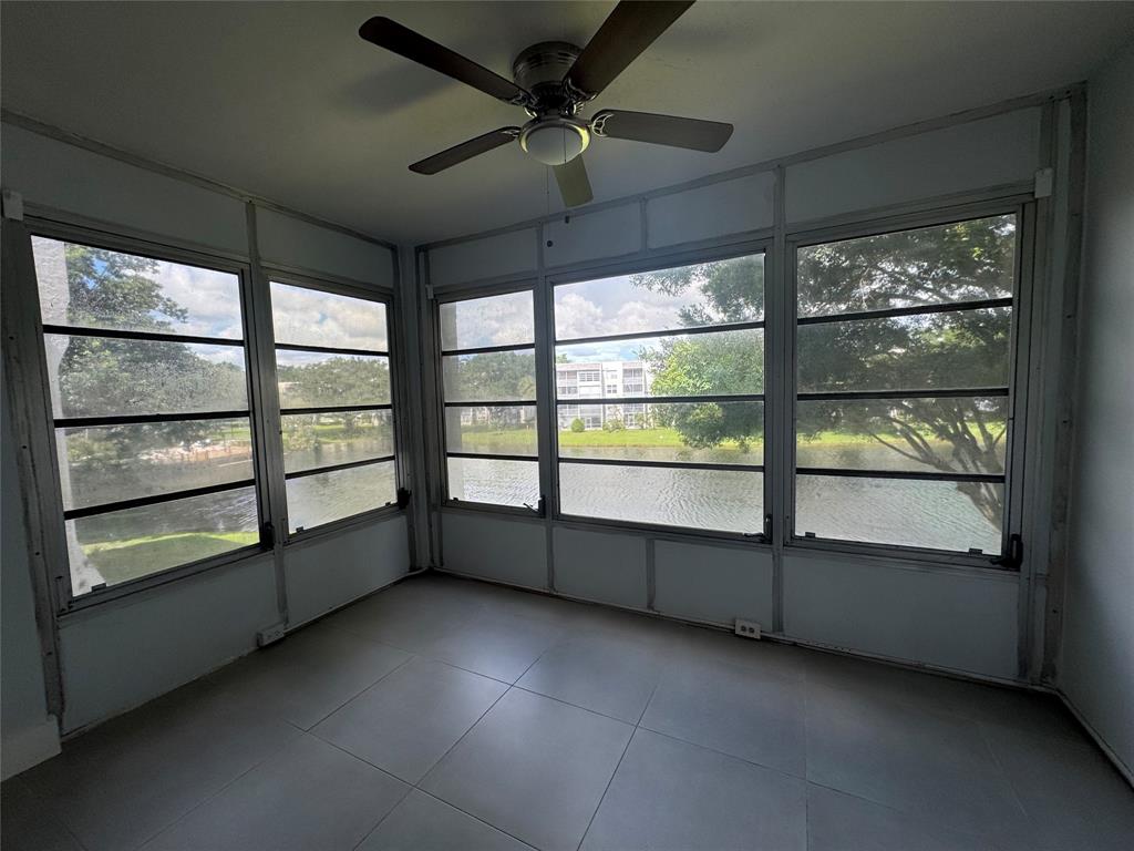 9235 A Lagoon Place, Unit 310 Davie, FL 33324 - Photo 9 of 32 an empty room with windows