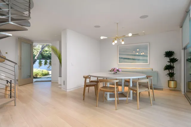a dining room with a table and chairs