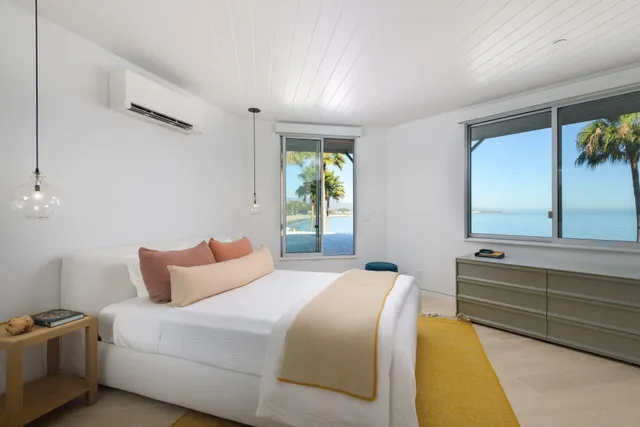 a bedroom with bed and window