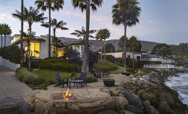 a view of a swimming pool with a table and chairs