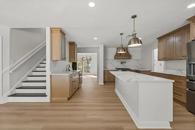 a kitchen with sink cabinets and window