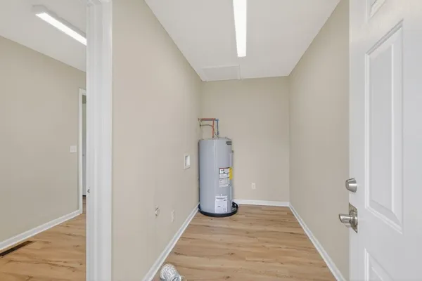 a view of a storage & utility room with wooden floor