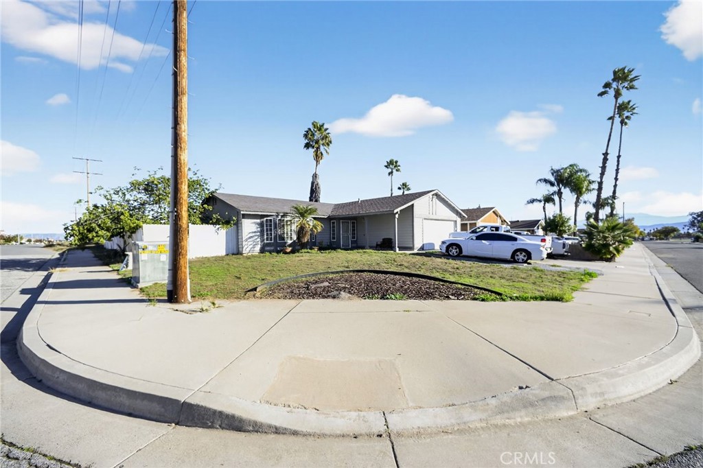 498 Serrana Road Perris, CA 92570 - Photo 1 of 8 a view of houses with yard