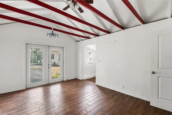 a view of an entryway with wooden floor