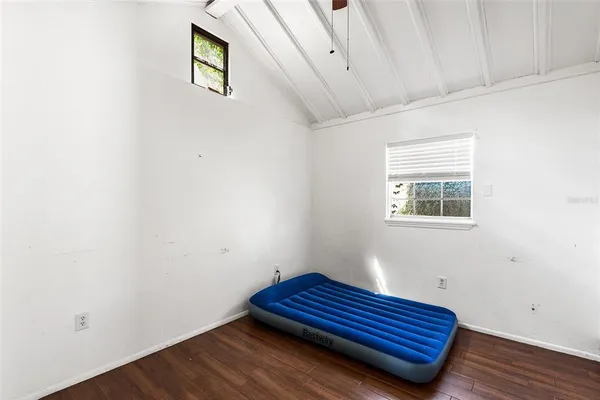 a room with a bed and a window