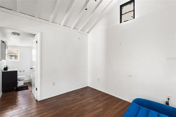 a view of a room with wooden floor and closet