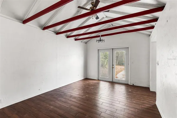 a view of a room with wooden floor and chair