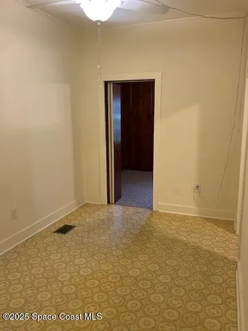 a view of an empty room and window