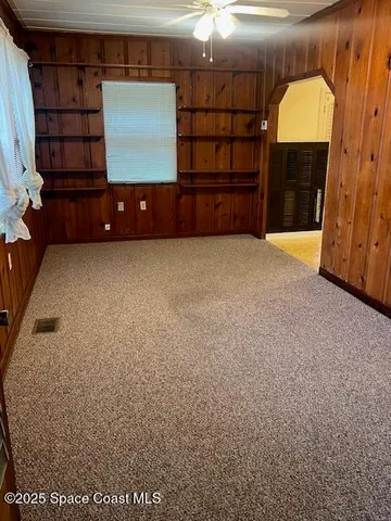 a view of a livingroom with furniture and window
