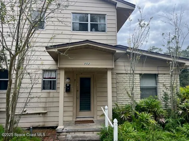 a front view of a house with a garage