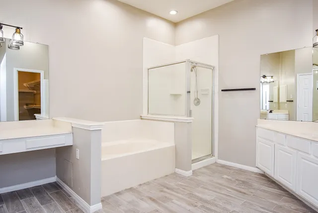 a bathroom with a bathtub and a sink