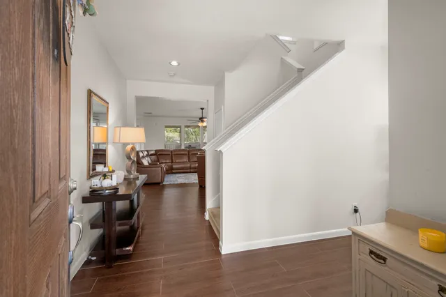 a view of living room with furniture and wooden floor
