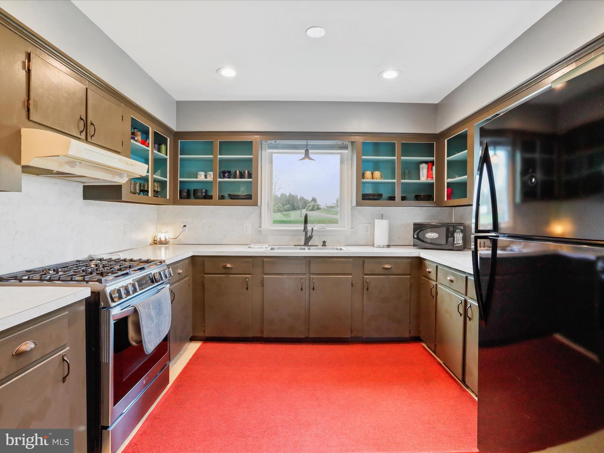 8610 Fort Valley Road Fort Valley, VA 22652 - Photo 23 of 61 a kitchen with stainless steel appliances granite countertop a sink and stove top oven