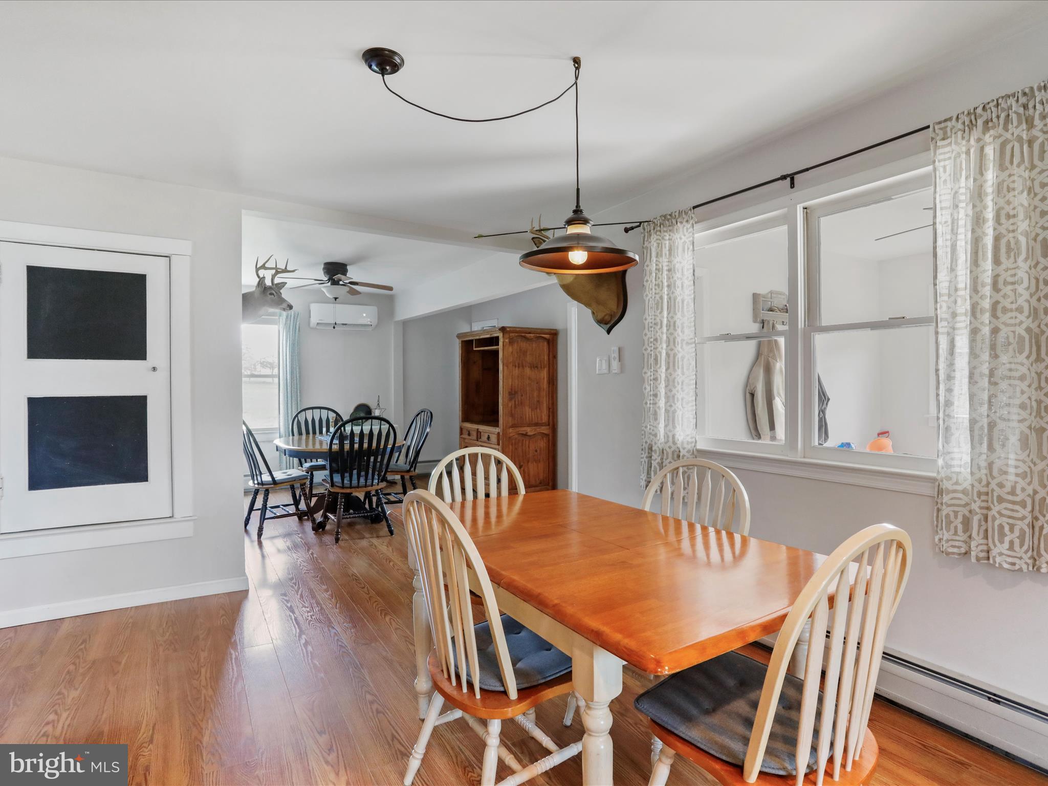 8610 Fort Valley Road Fort Valley, VA 22652 - Photo 26 of 61 a view of a dining room with furniture window and wooden floor