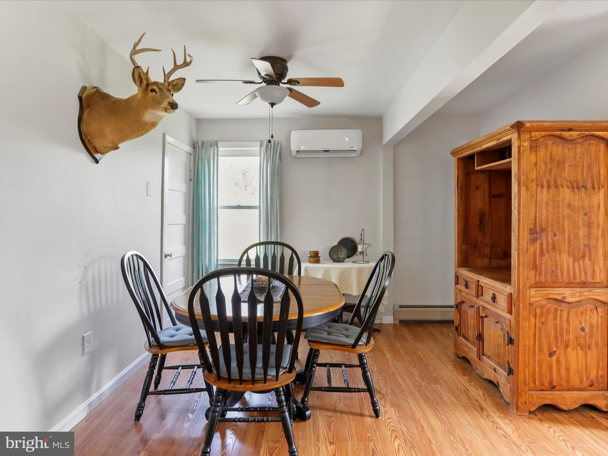 8610 Fort Valley Road Fort Valley, VA 22652 - Photo 27 of 61 a view of a dining room with furniture and wooden floor