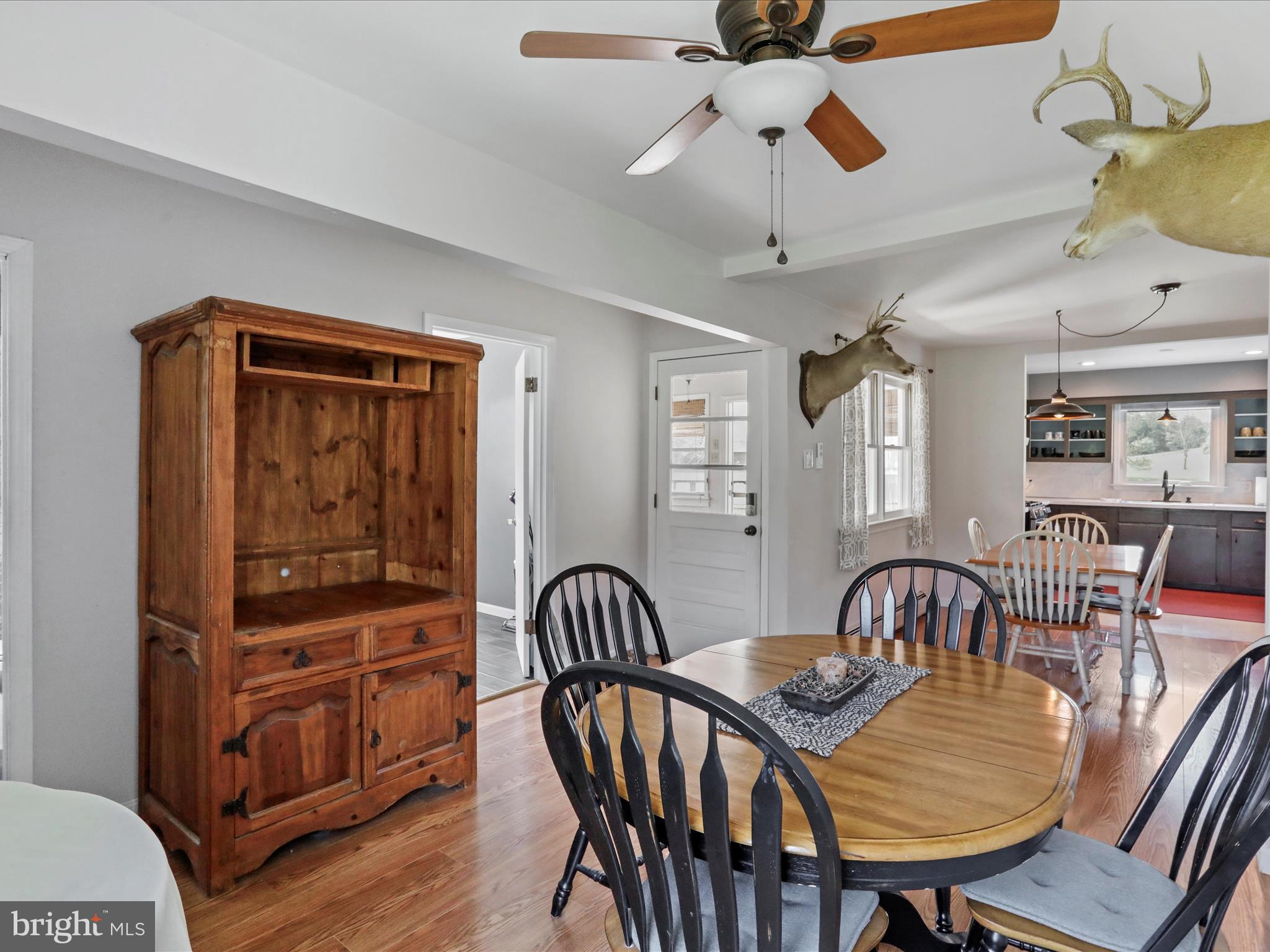 8610 Fort Valley Road Fort Valley, VA 22652 - Photo 29 of 61 a view of a dining room with furniture window and wooden floor