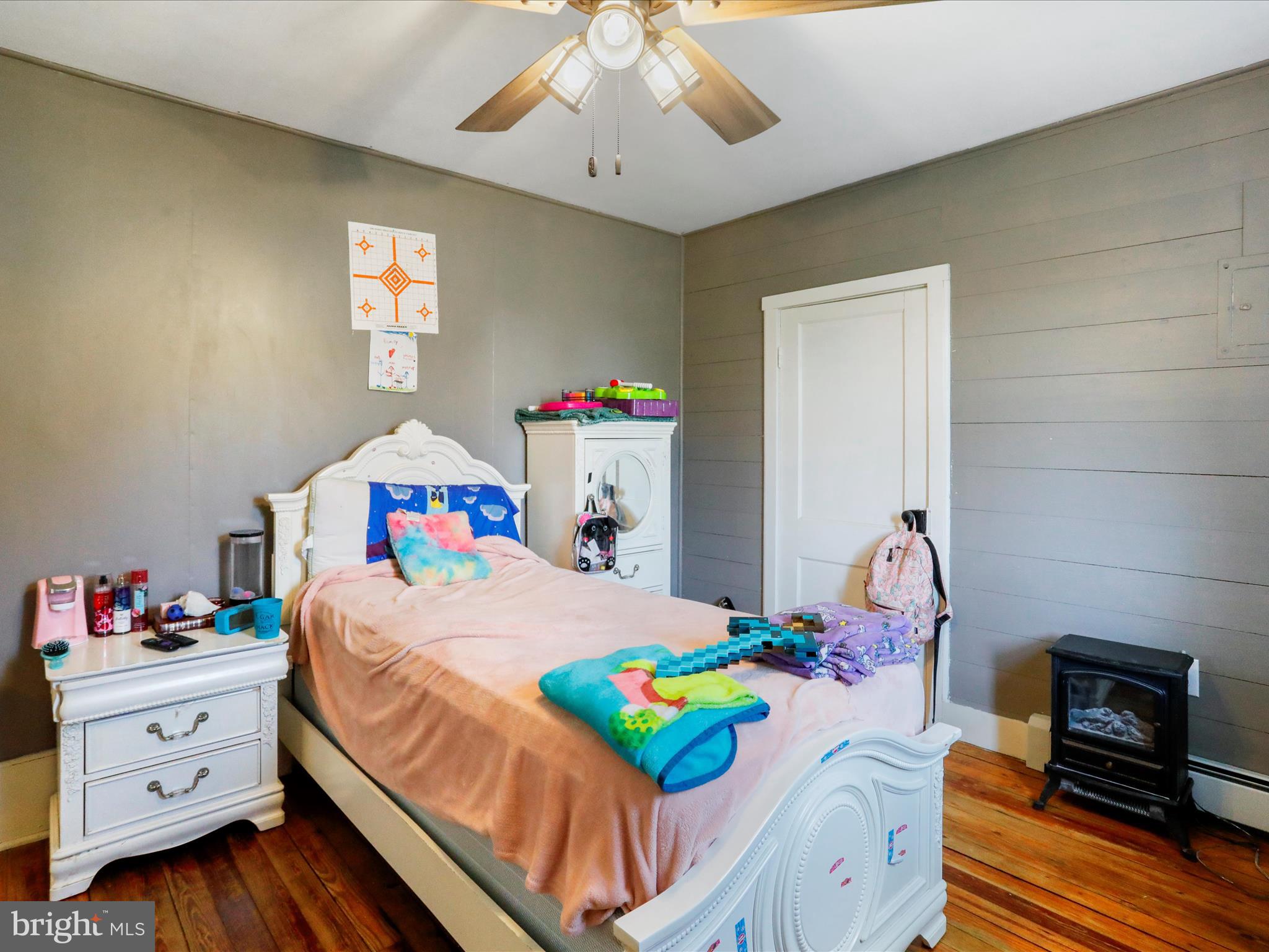8610 Fort Valley Road Fort Valley, VA 22652 - Photo 32 of 61 a bedroom with a bed and wooden floor