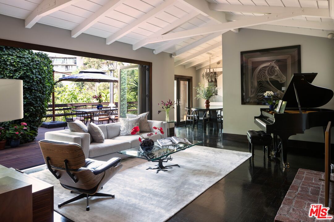 6464 Bryn Mawr Drive Los Angeles, CA 90068 - Photo 1 of 23 a living room with furniture and a large window
