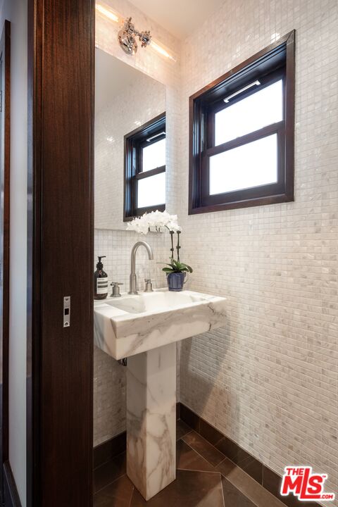 6464 Bryn Mawr Drive Los Angeles, CA 90068 - Photo 16 of 23 a bathroom with a sink and a mirror