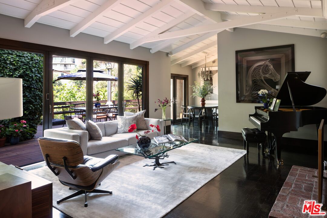6464 Bryn Mawr Drive Los Angeles, CA 90068 - Photo 2 of 23 a living room with furniture and a large window