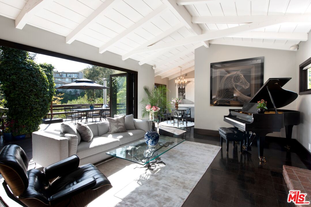 6464 Bryn Mawr Drive Los Angeles, CA 90068 - Photo 3 of 23 a living room with furniture and a large window