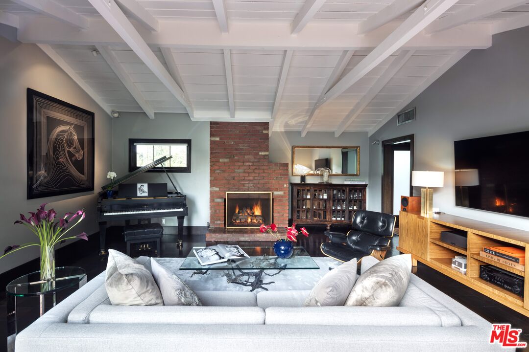 6464 Bryn Mawr Drive Los Angeles, CA 90068 - Photo 4 of 23 a living room with furniture and a flat screen tv