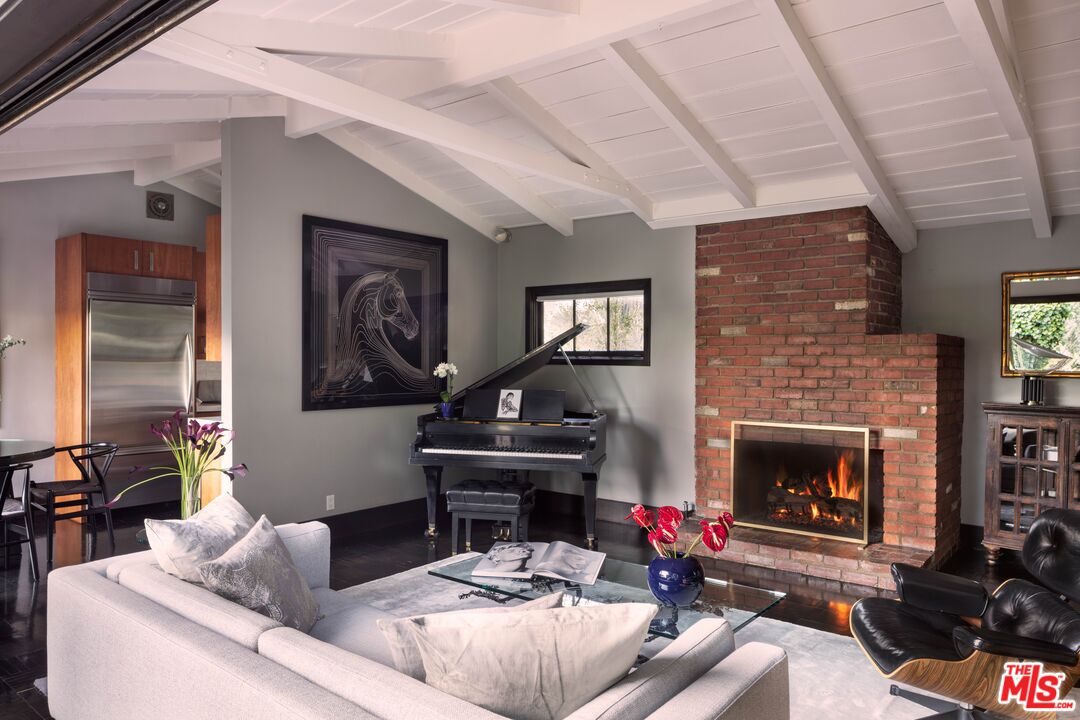 6464 Bryn Mawr Drive Los Angeles, CA 90068 - Photo 5 of 23 a living room with furniture and a fireplace