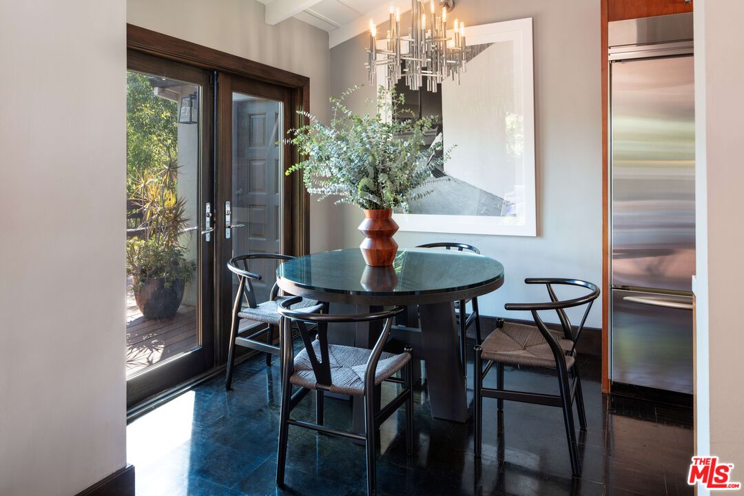 6464 Bryn Mawr Drive Los Angeles, CA 90068 - Photo 9 of 23 a view of a dining room with furniture and chandelier
