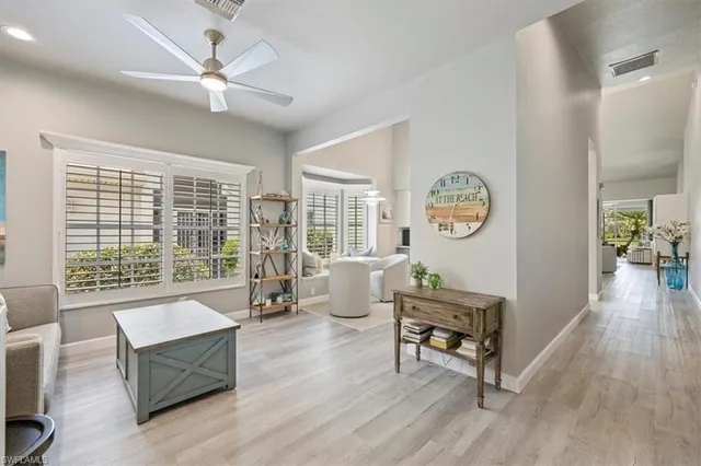 a living room with furniture and a window