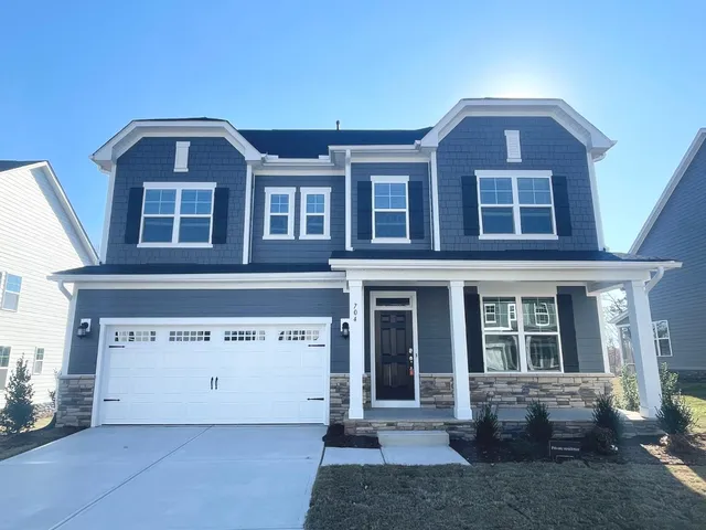 a front view of a house with glass windows
