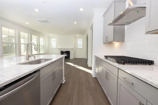 a view of kitchen with refrigerator microwave and wooden floor