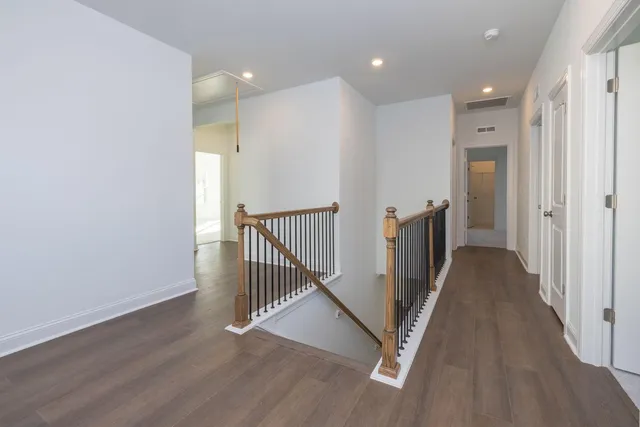 a bedroom with bed and a large window